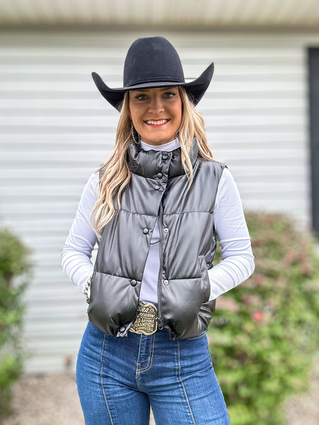 black faux leather padded vest.