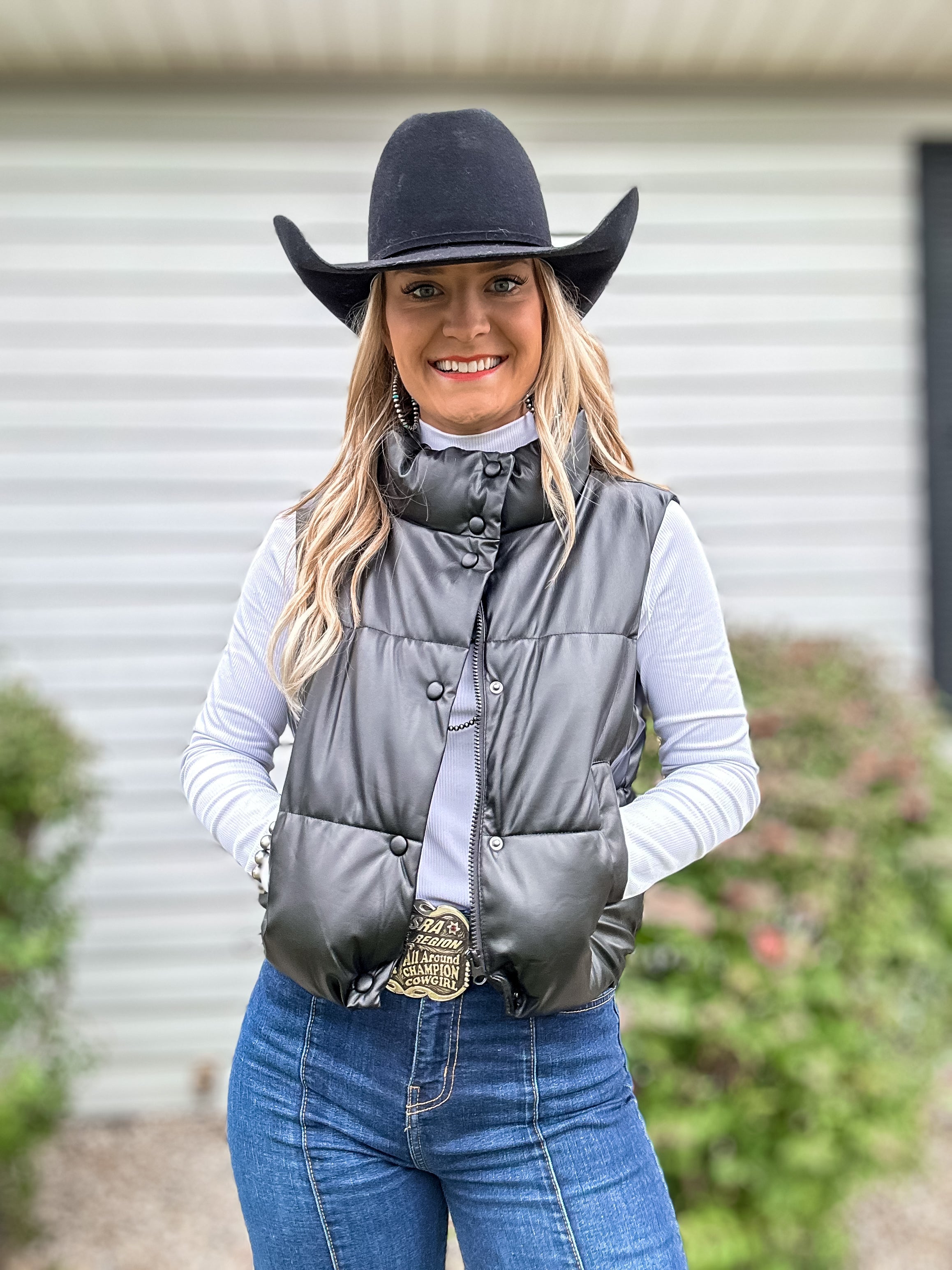 black faux leather padded vest.