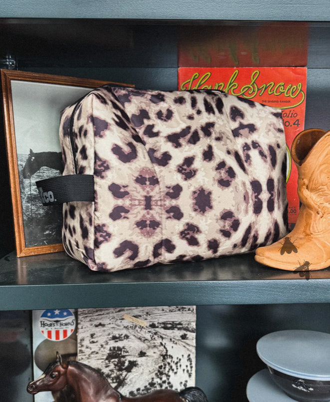Leopard print cosmetic travel pouch.