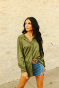 Green long sleeve button up shirt with turquoise pearl snaps