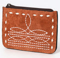 A brown suede leather card holder with hand stitched edges and a zipper closure.