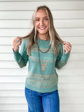 Aqua colored sweater with a longhorn and Aztec pattern