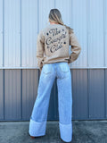 Beige crewneck sweatshirt with the text 'Cowgirl Club' written on the back
