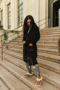 Plush black robe with boot stitch details in a silvery metallic thread