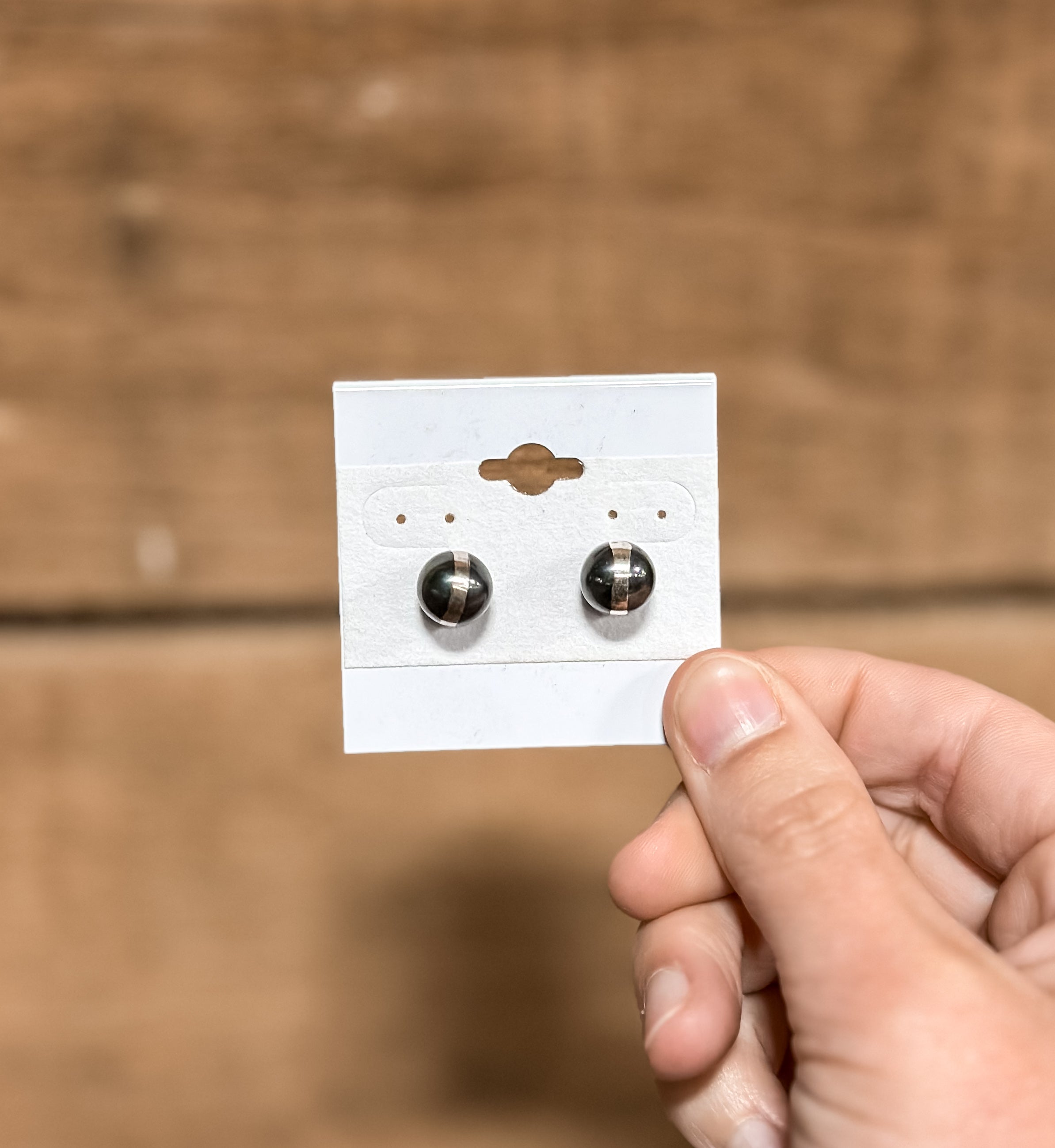 A pair of 10mm sterling silver pearl stud earrings 