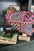 A colorful geometric patterned toiletry bag 