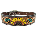 A brown leather dog collar with a floral pattern, featuring a metal buckle and hardware.