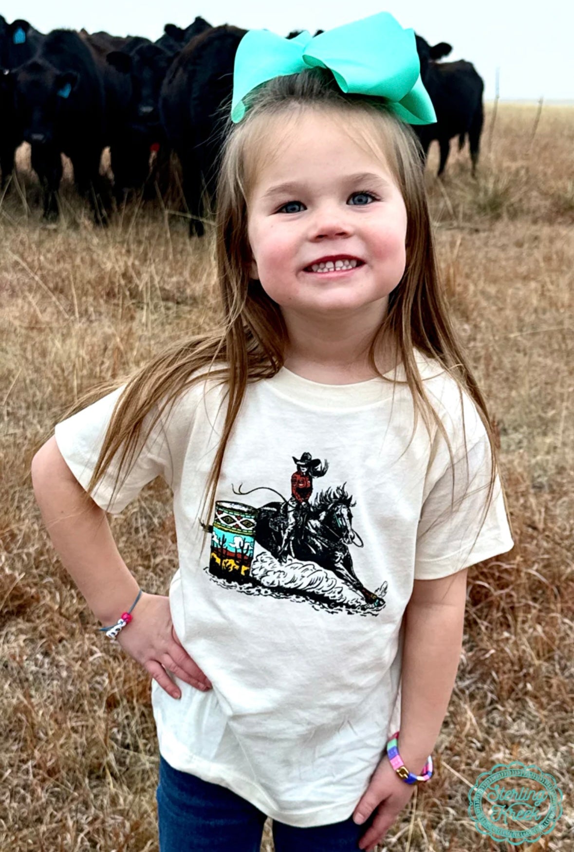 Cream colored t-shirt with a colorful barrel racer design.