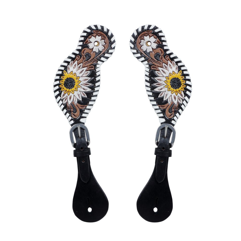 A pair  tooled leather spur straps with a floral pattern in yellow, white, and black colors, and a dash of brown.