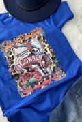 A blue t-shirt with a graphic print of a cowboy and text that reads “Welcome to the Cowboy Ranch”