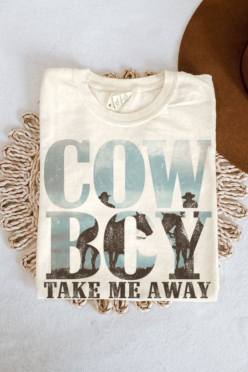 Women’s ivory colored mineral wash graphic tee that reads Cowboy Take Me Away with a horseback cowboy in the text.