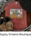 Pink girl’s onesie with a barrel racing image on the front