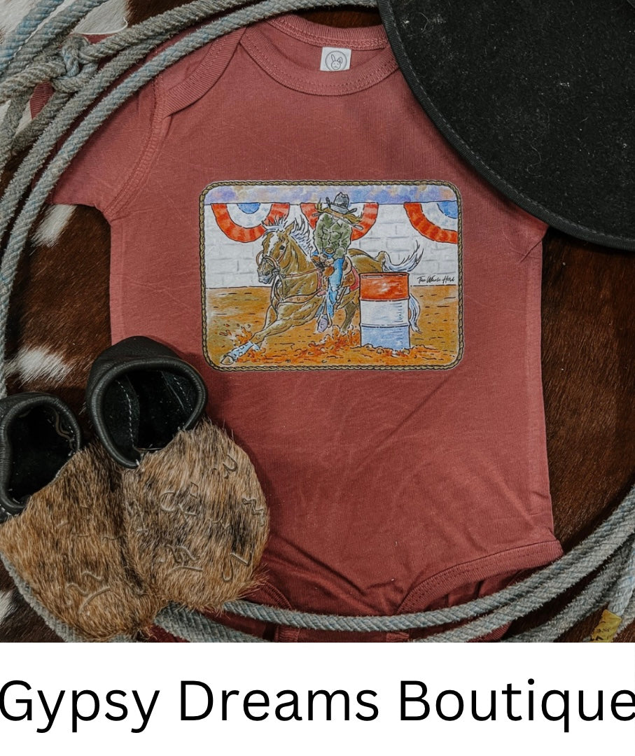 Pink girl’s onesie with a barrel racing image on the front