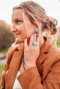 Silver burst post stud earring with turquoise accent in center