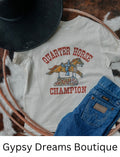 Cream colored kids tee with a toy riding horse that reads Quarter Horse Champion